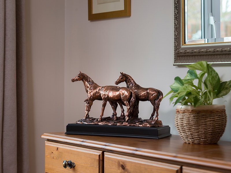 Our lovely figurine ashes keepsake urns are so discreet and look lovely in any setting. Sculptured ornamental ashes urns caskets.